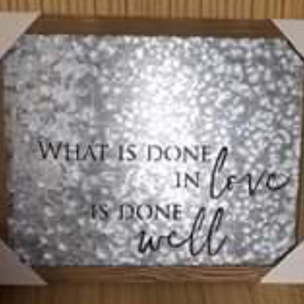 What is done in love is done well wall art